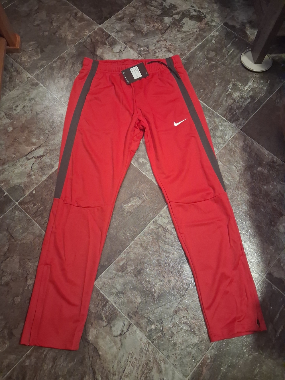 Nike Menโs Red Athletic Track Pants with Contrast Side Stripe